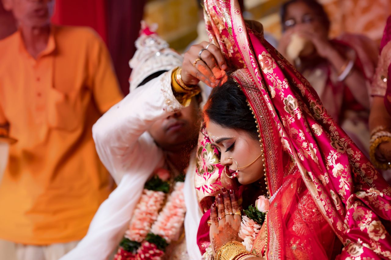 The Art of Drawing Readers In: Your attractive post title goes here Bride and groom perform traditional wedding rituals in a vibrant cultural ceremony.